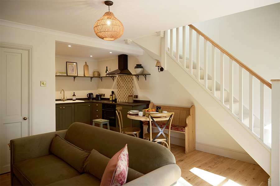Living room and kitchen area at a Holiday Cottage at Great Ashley Farm in Bradford-On-0Avon