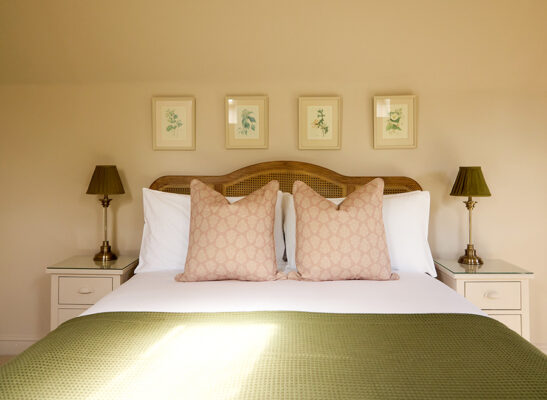 A front view of the bed inside Wisteria, a holiday cottage in the countryside at Great Ashley Farm in Wiltshire